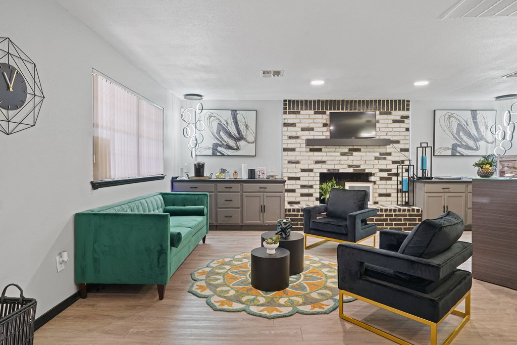 large clubhouse with green couch and chairs