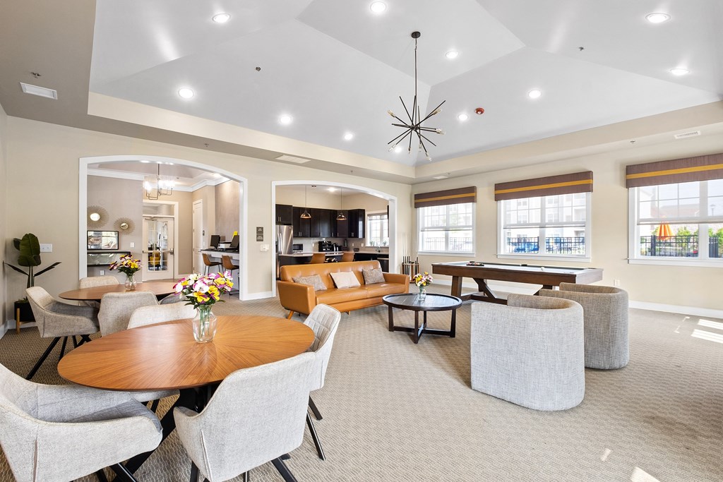 a living room with couches and chairs and a table at The Landing Apartment , Hazlet, New Jersey