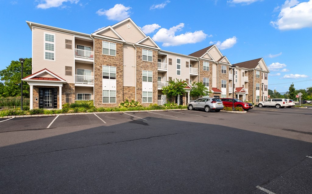 an empty parking lot in front of an apartment building at The Landing Apartment , Hazlet, New Jersey