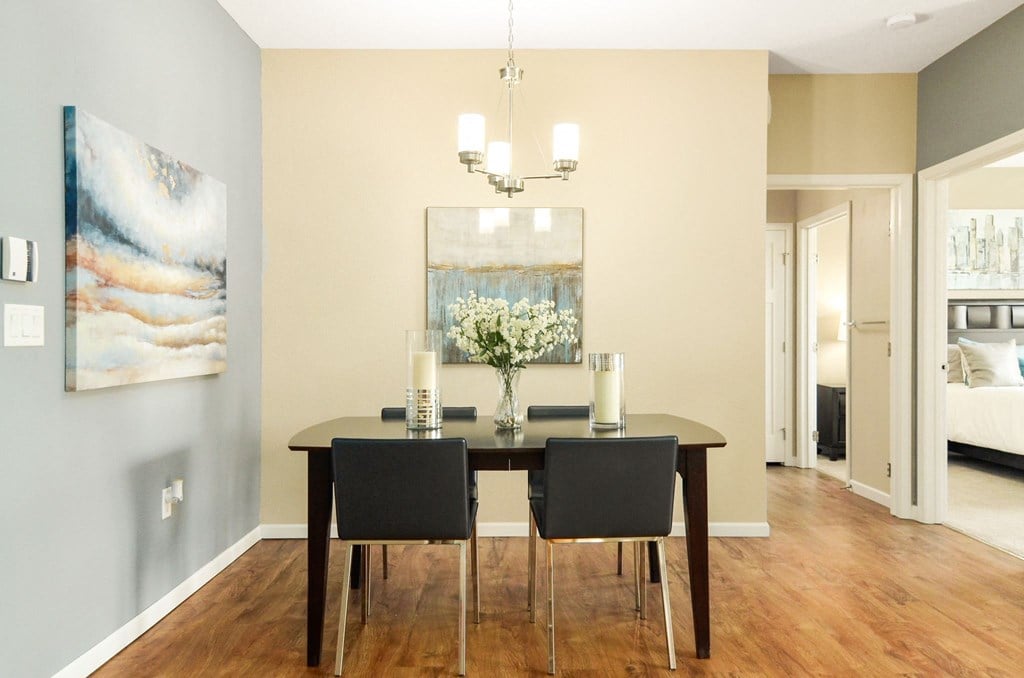 a dining room with a table and chairs at Skye at Arbor Lakes, Maple Grove, Minnesota
