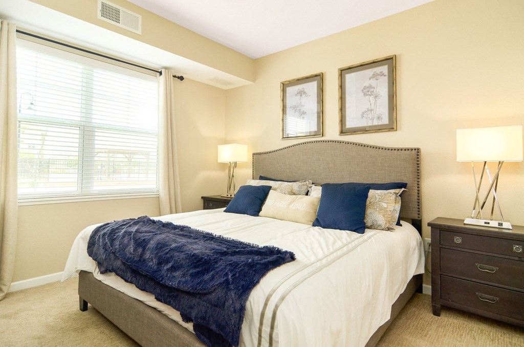 one of the bedrooms at the enclave at woodbridge apartments in sugar land, tx at Skye at Arbor Lakes, Maple Grove