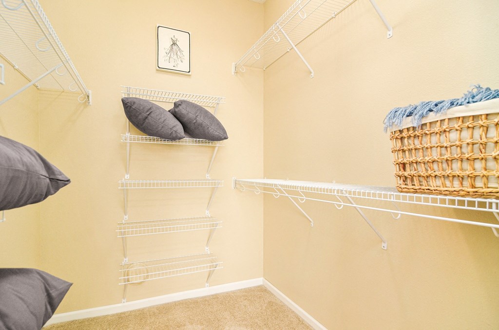 a walk in closet in the master bedroom at Skye at Arbor Lakes, Maple Grove, Minnesota