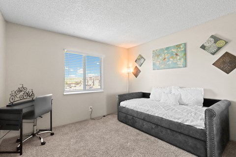 a bedroom with a bed and a desk at Park 88 Apartments, Colorado, 80229