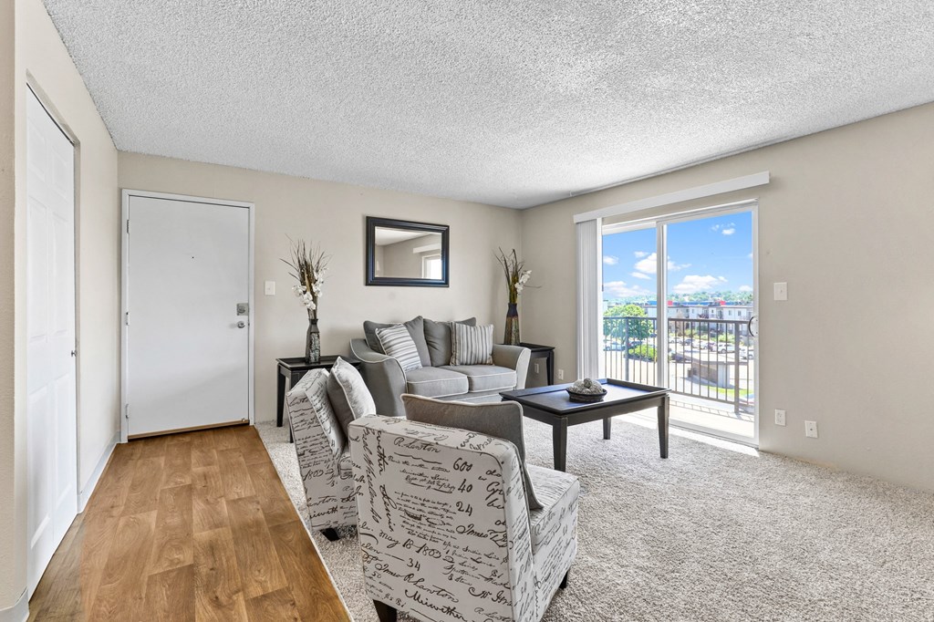 a living room with a couch and two chairs