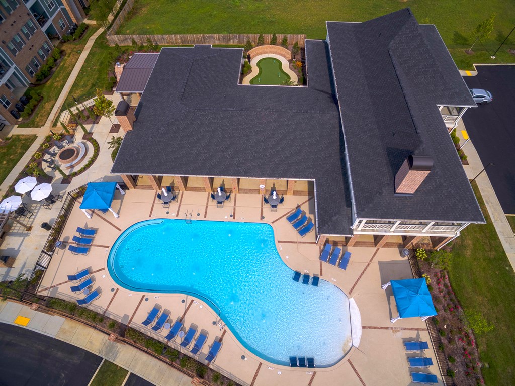 an aerial view of a swimming pool in front of a house at Annandale Apartment Homes, Tennessee
