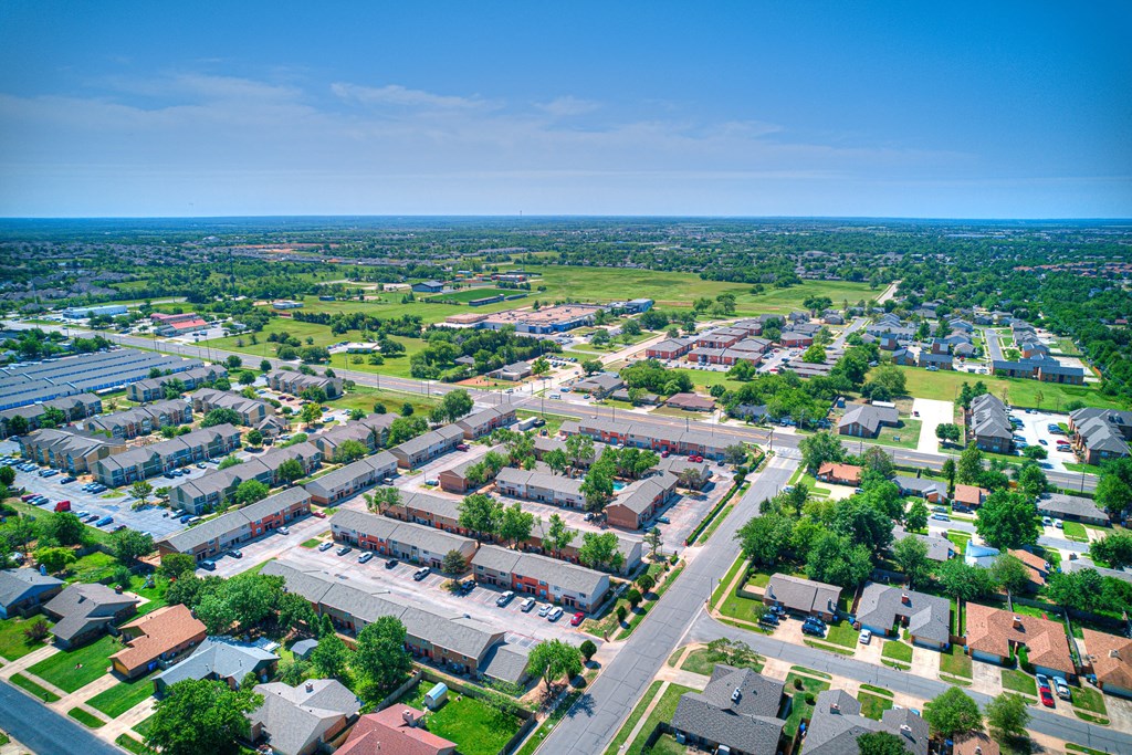 an aerial view of a suburban neighborhood with houses and trees