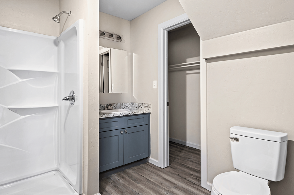 a bathroom with a toilet and a sink and a shower at Diamond Ridge Townhomes, Oklahoma ,73114