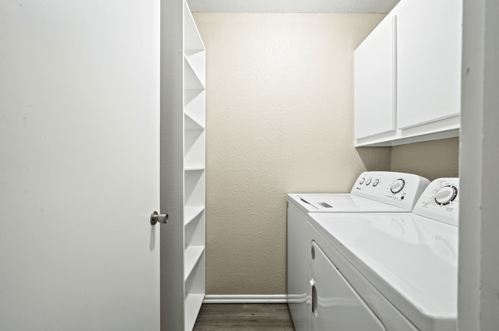 a laundry room with a washer and dryer and a closet at Diamond Ridge Townhomes, Oklahoma