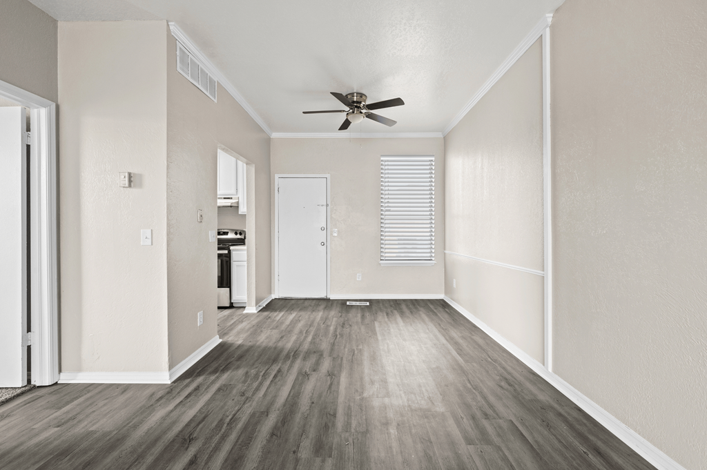 an empty room with white walls and a ceiling fan at Diamond Ridge Townhomes, Oklahoma City, 73114