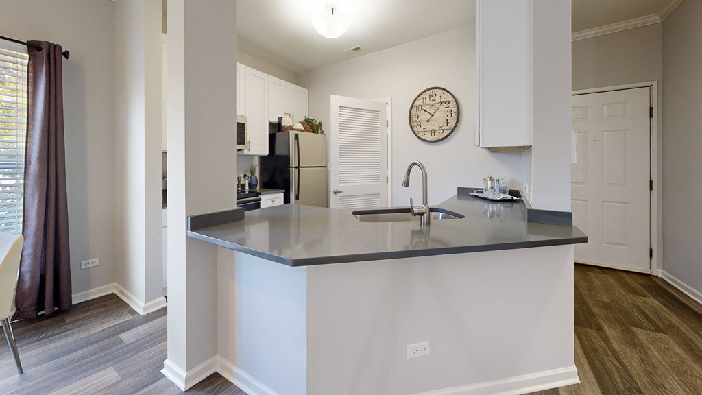 a kitchen with a large counter top and a sink at Dwell at Naperville, Naperville, Illinois