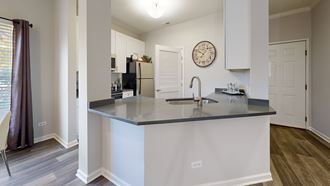 a kitchen with a large counter top and a sink