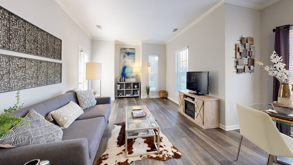 a living room with a couch and a tv at Dwell at Naperville, Naperville, Illinois