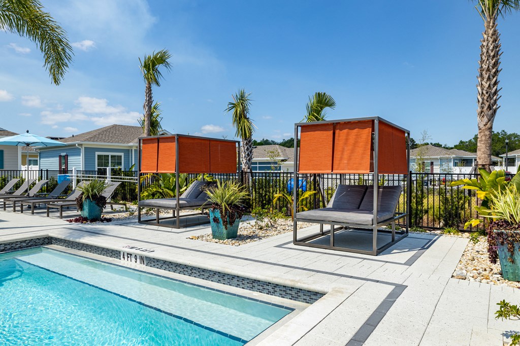 Sun deck next to a resort style swimming pool at Estia at Lakewood Ranch, Bradenton, FL, 34211