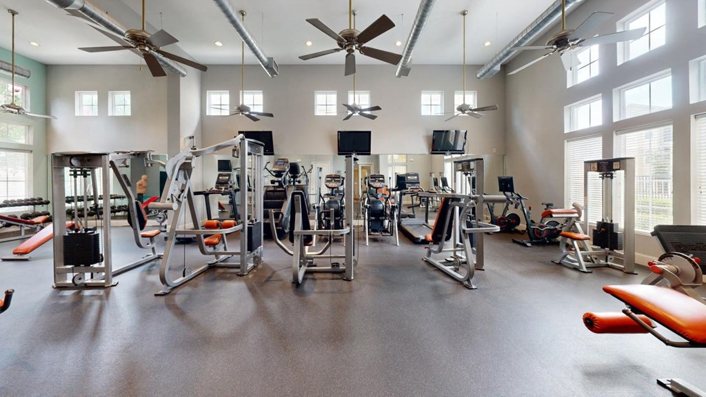 the gym with workout equipment at The Millennium Towne Center Apartments, Baton Rouge, Louisiana