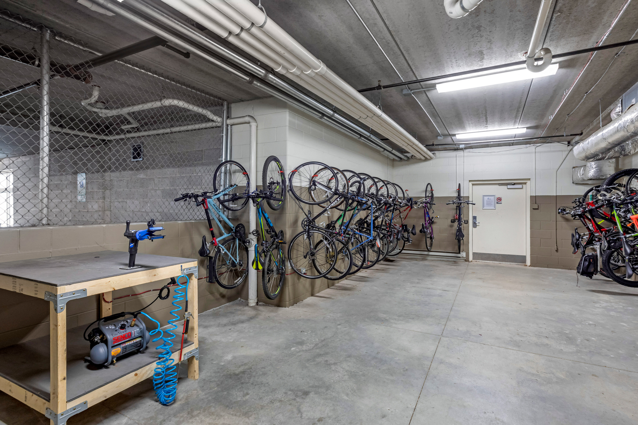 Bike storage and repair room at The Enclave Luxury Apartments