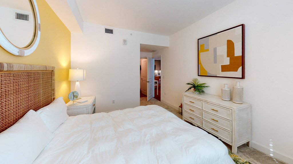 a bedroom with a bed and a dresser at The Lotus at Village Walk, Fort Myers, FL, 33966