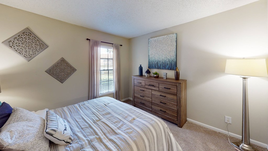 a bedroom with a bed and a window at Laurel Oaks Apartments, Tampa, 33637