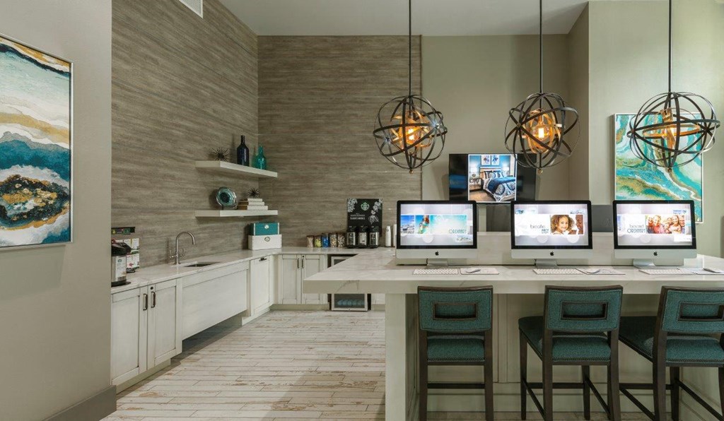 a room with a table with computers on it