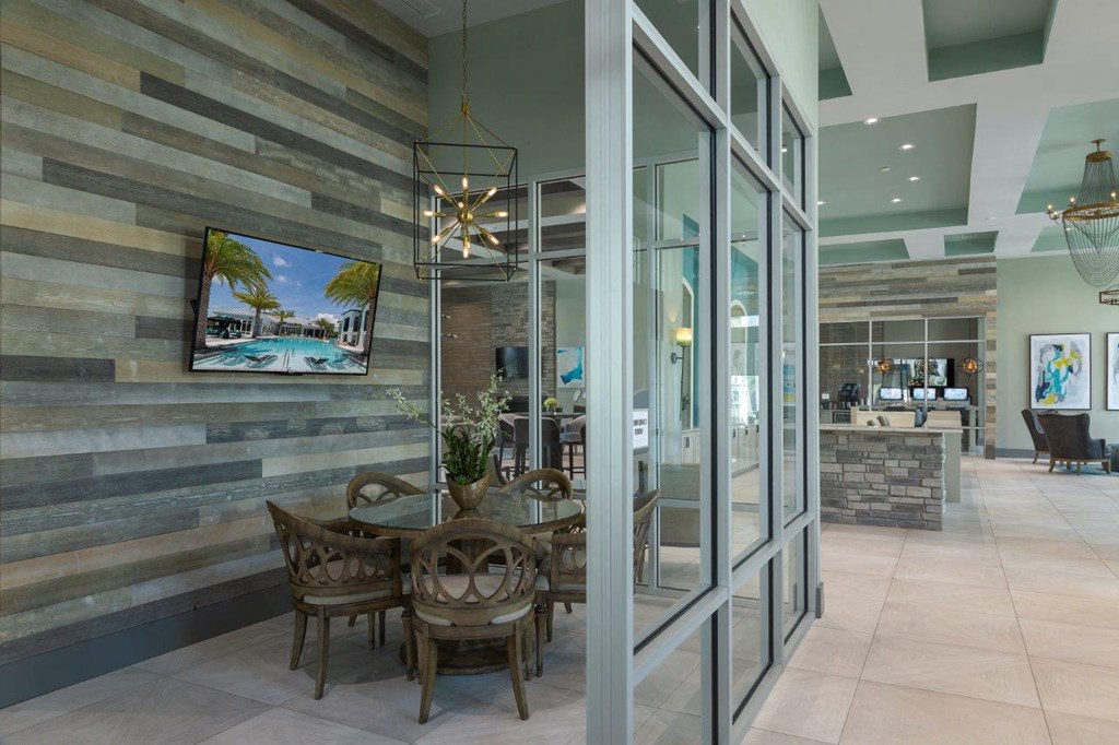 a dining room with glass doors and a table and chairs