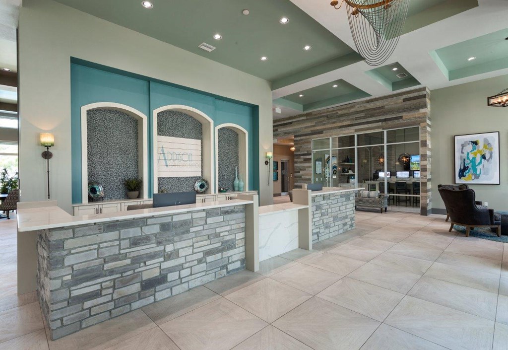 the lobby of a spa with a reception desk