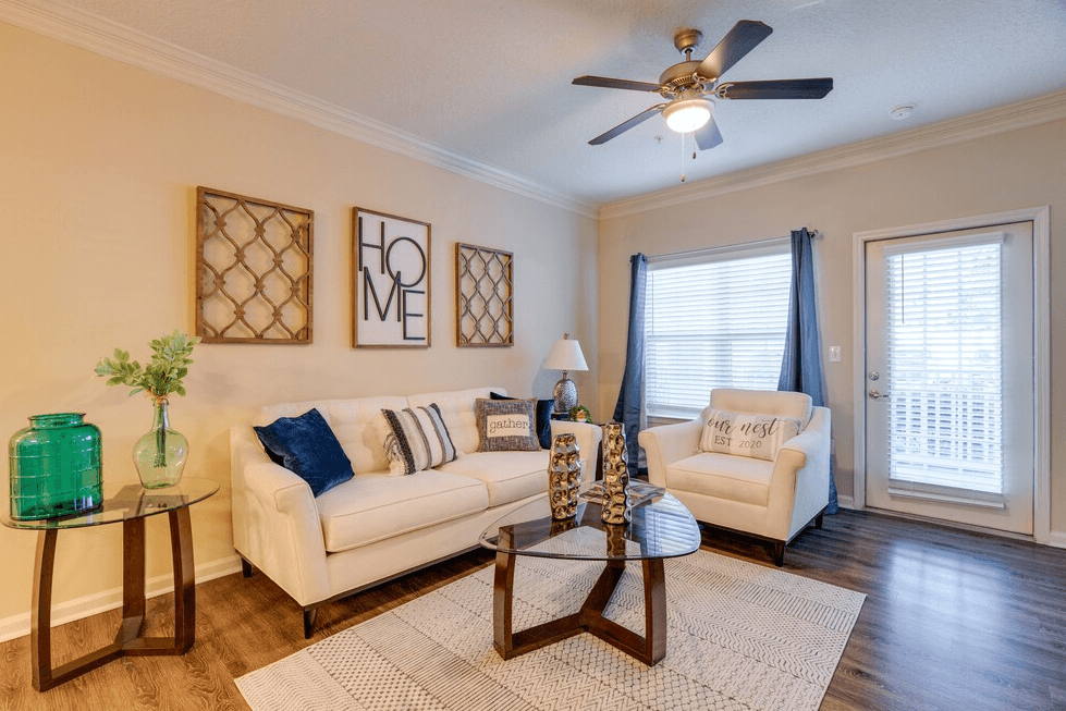 a living room with two couches and a coffee table at Magnolia Village Apartments, Jacksonville, FL, 32207