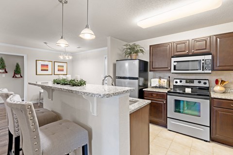 a kitchen with stainless steel appliances and a granite counter top