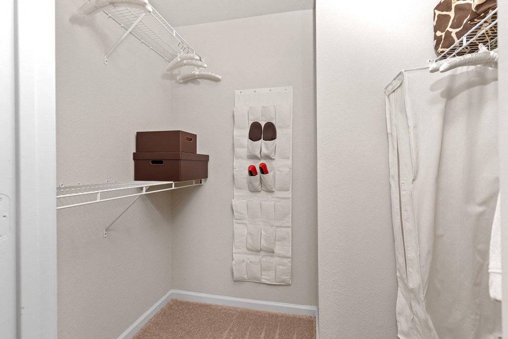 a walk in closet in a 555 waverly unit