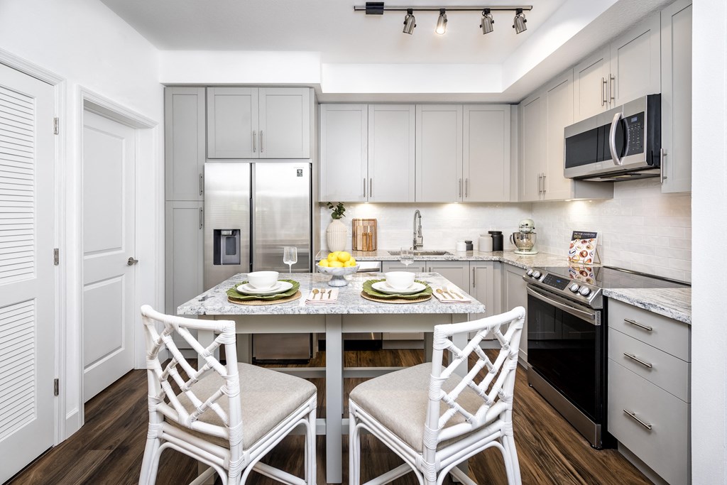 Dining And Kitchen at The Lotus at Village Walk, Fort Myers, FL, 33966