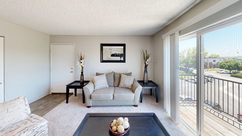 a living room with a couch and a coffee table at Park 88 Apartments, Colorado