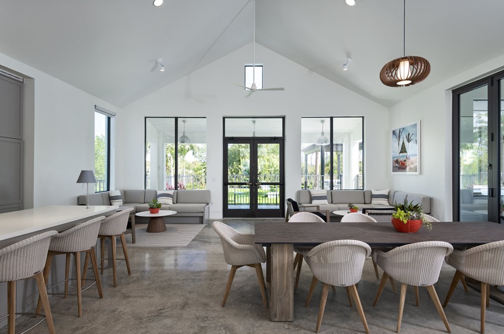 a living room with a large table and chairs at Odyssey, Florida
