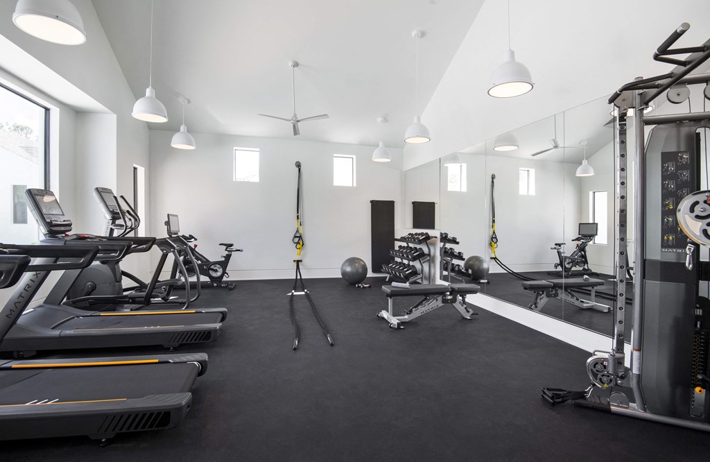 a large fitness room with treadmills and other exercise equipment at Odyssey, Florida, 33905