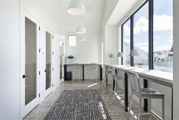 a kitchen with a long counter and a large window at Odyssey, Florida