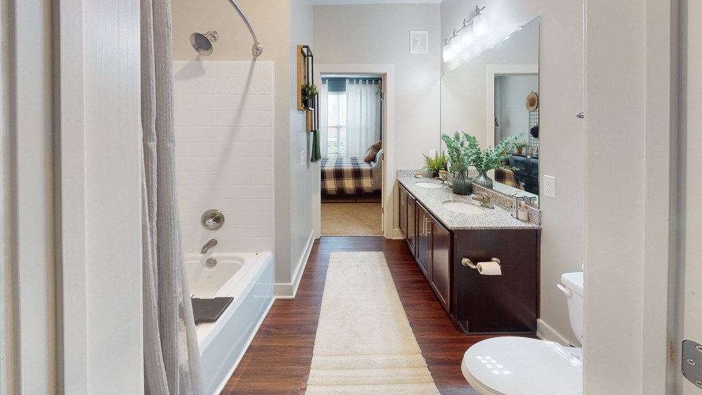 a bathroom with a tub and a sink