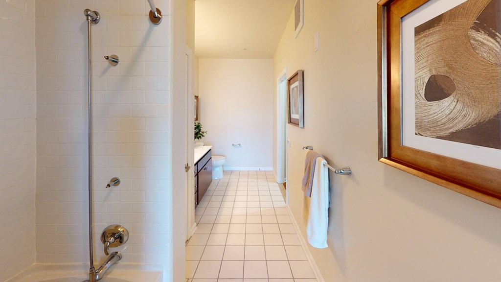 a bathroom with a shower and a sink at The Reserve at Riverdale, Riverdale, NJ, 07457