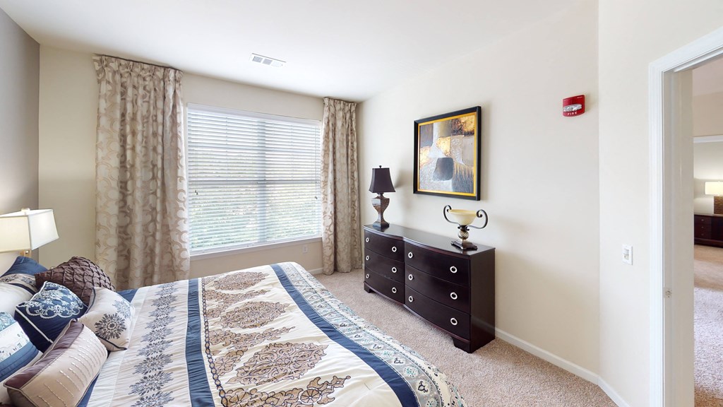 a bedroom with a large window at The Reserve at Riverdale, Riverdale, New Jersey
