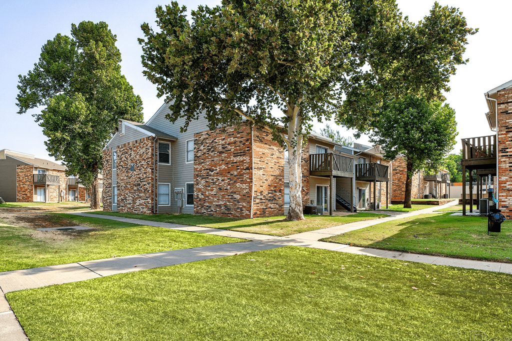 our apartments have a spacious courtyard with trees and grass at Diamond  Trail Apartments, Oklahoma City, 73112