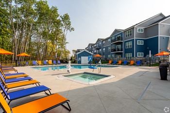 our apartments have a large pool with lounge chairs and umbrellas