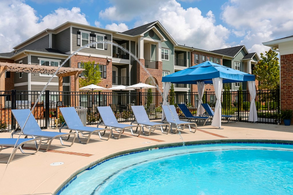 our apartments offer a swimming pool with chairs and umbrellas at Annandale Apartment Homes, Murfreesboro, 37128