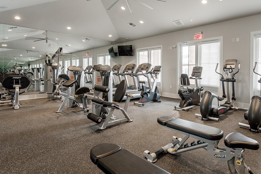 a gym with cardio equipment and weights on the floor at Annandale Apartment Homes, Murfreesboro, TN, 37128