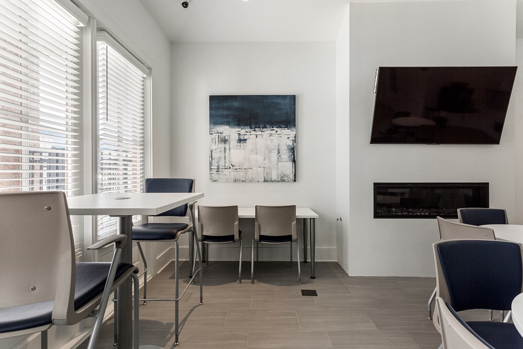 a dining room with a table and chairs and a fireplace at Annandale Apartment Homes, Tennessee