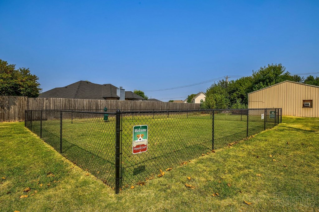 grassy area with fence