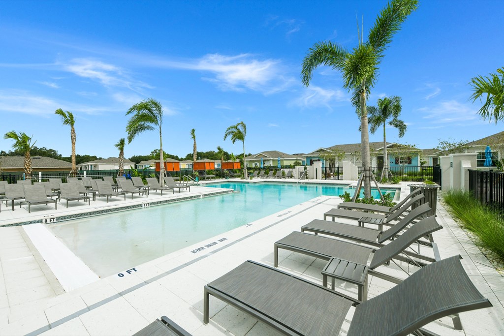 Sun deck next to a resort style swimming pool at Estia at Lakewood Ranch, Bradenton, Florida