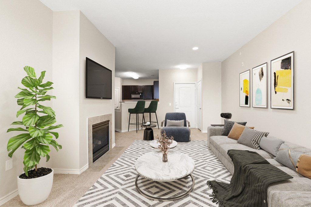 a living room with a fireplace and a tv
