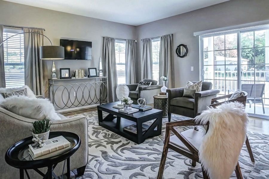 model living room with grey furniture at Hillside Club Apartments, Livingston, NJ