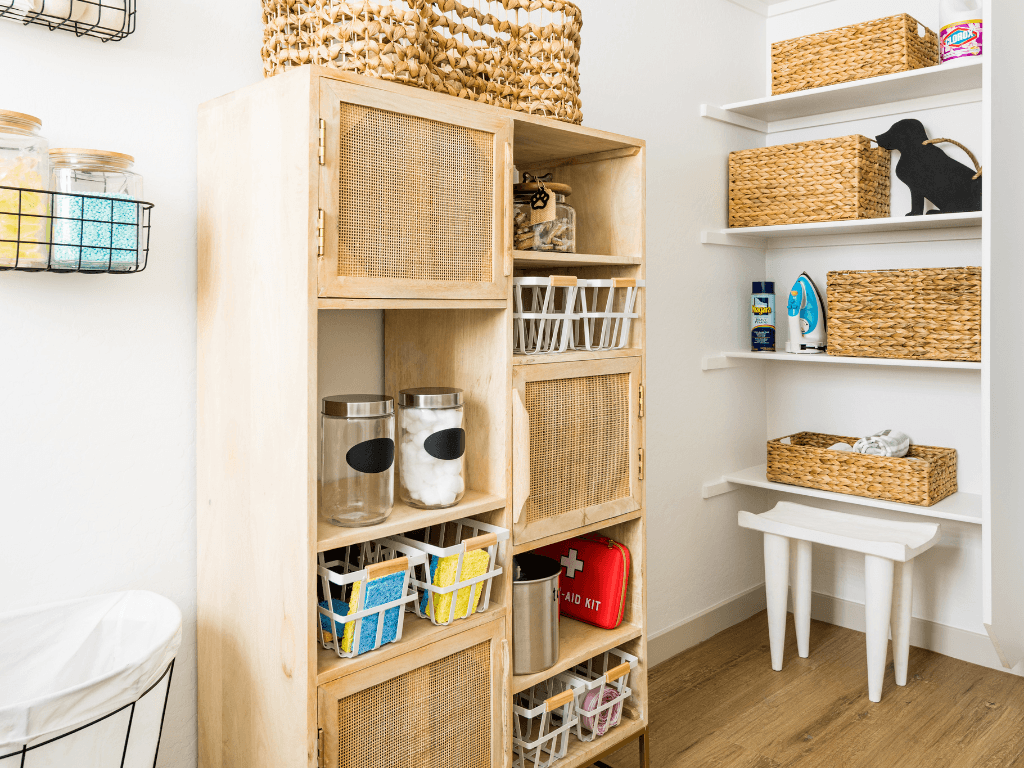 a room with a wooden shelf with baskets and other items on it