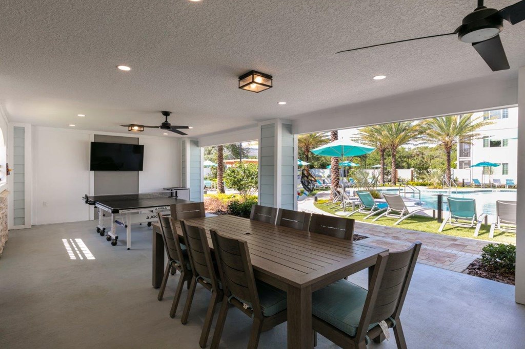 a view of a building with windows and a reflection at Enclave at 3230 Apartments, South Daytona