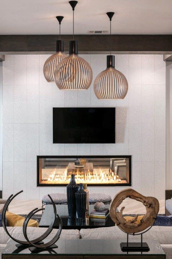 a living room with a fireplace and a tv above it at Enclave at 3230 Apartments, South Daytona, FL