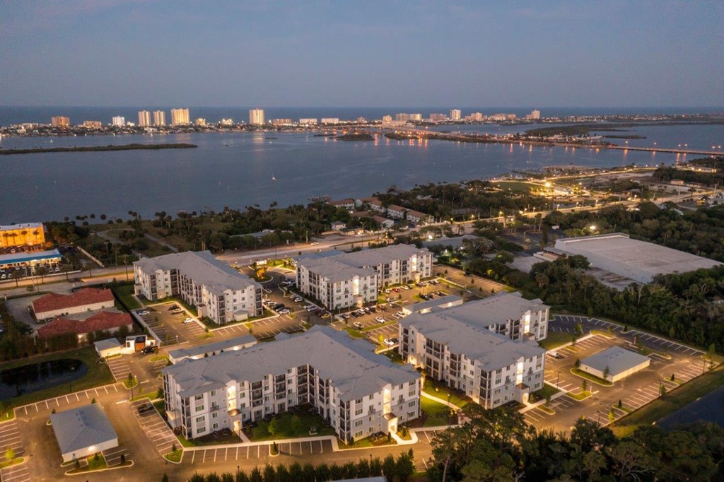 an aerial view of a city at night at Enclave at 3230 Apartments, Florida, 32119