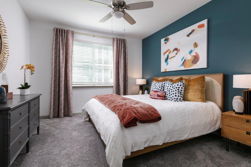 a bedroom with a bed and a ceiling fan at Enclave at 3230 Apartments, South Daytona, Florida