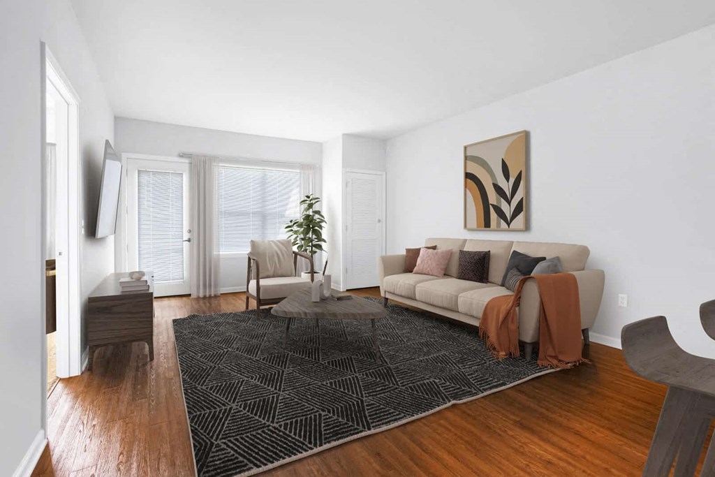 a living room with a couch and a rug at Wheaton 121, Wheaton, IL